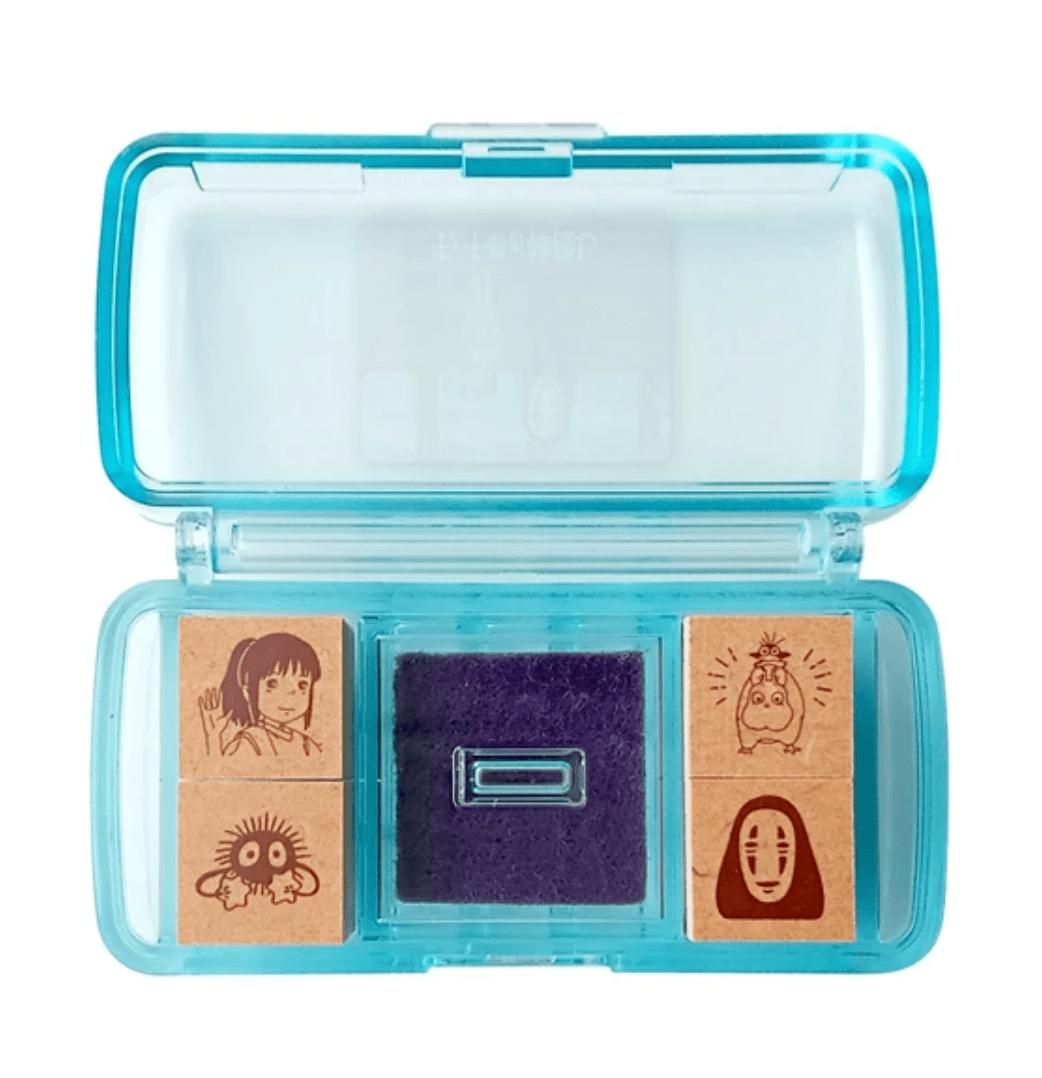 Spirited Away stamps in opened plastic case with inkpad in the middle
